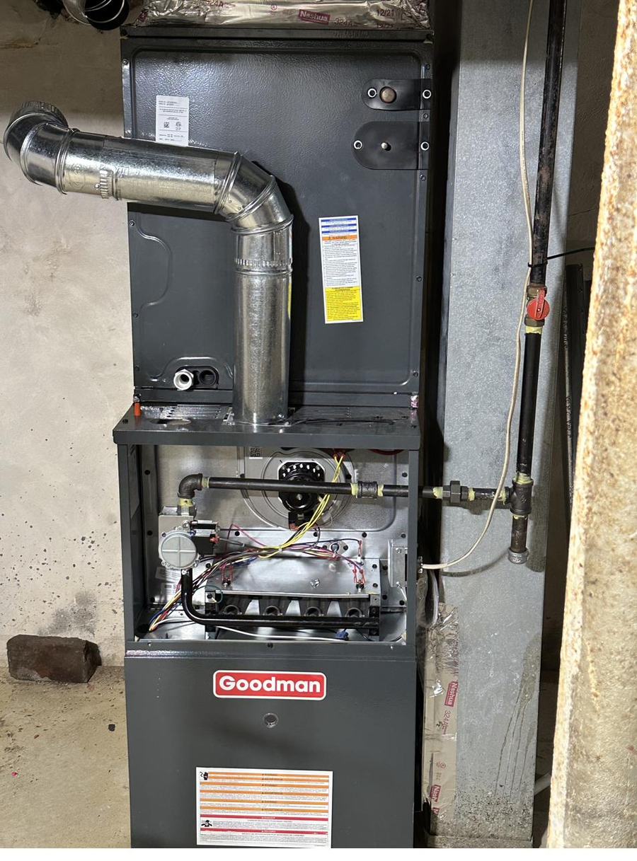 New furnace and flue piping in a finished basement
